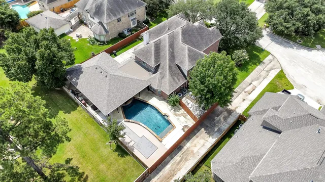 an aerial view of a house with swimming pool