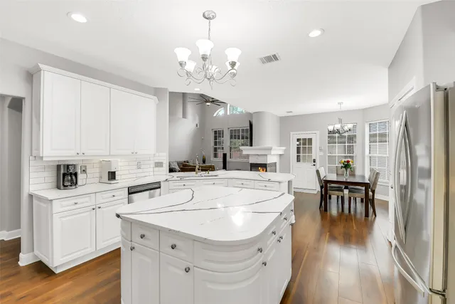 a kitchen with a sink stove and cabinets