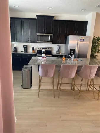 a kitchen with a sink cabinets and window