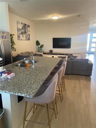 a kitchen with a table and chairs in it