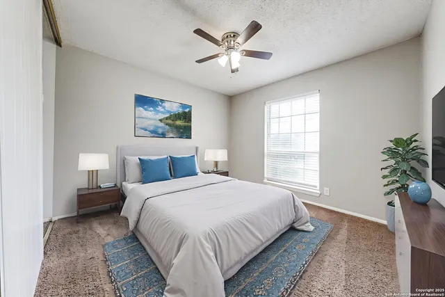 a bedroom with bed and window