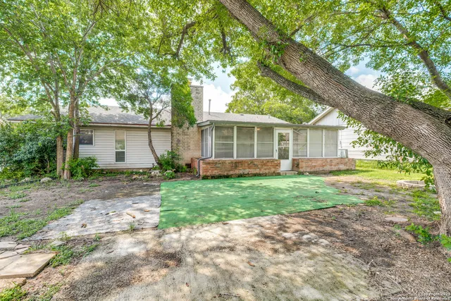 a view of a house with yard and a garden