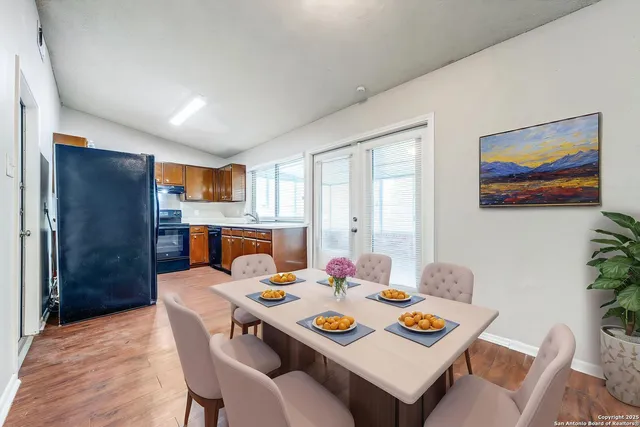 a dining room with furniture and window
