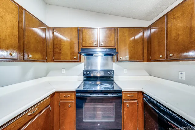 a kitchen with a stove and a microwave