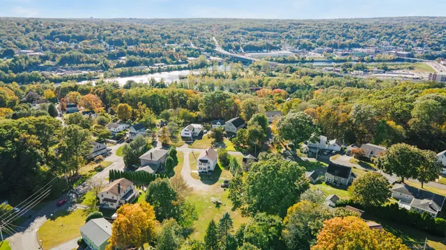 a bedroom with a bed window and a table