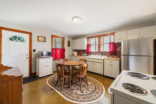 a bathroom with a tub a sink and a shower