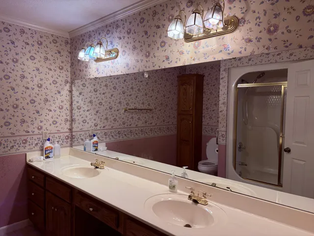 a bathroom with a sink and a mirror