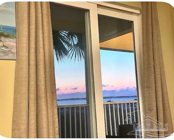 a view of a balcony with a floor to ceiling window