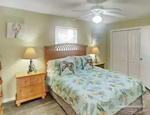 a bedroom with a bed and a lamp
