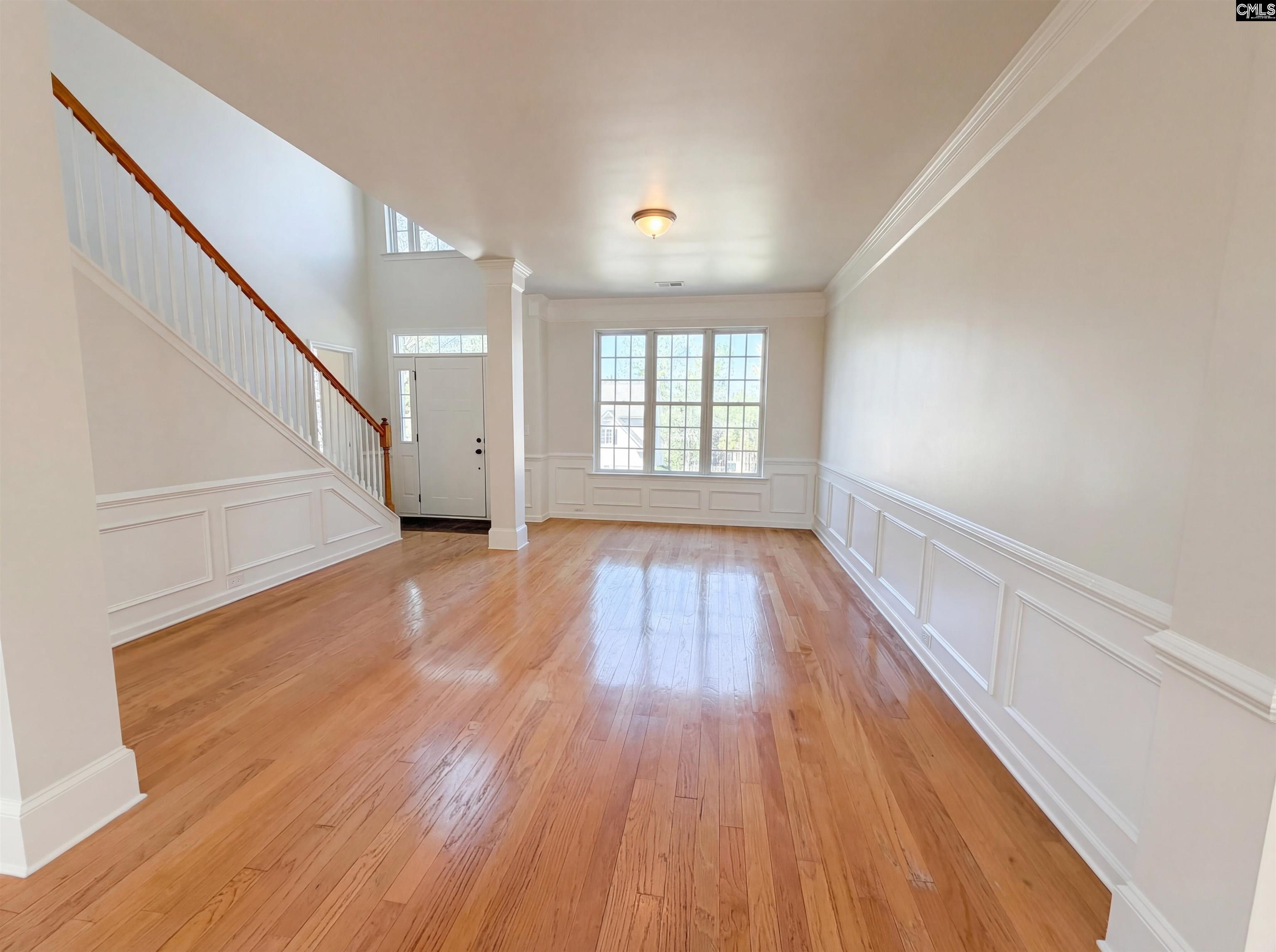112 Coopers Hawk Circle Irmo, SC 29063 - Photo 16 of 26 wooden floor in an empty room with a window