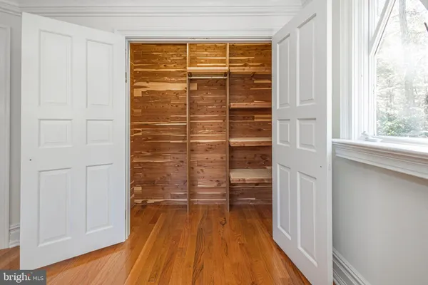 a room with water heater and stainless steel appliances