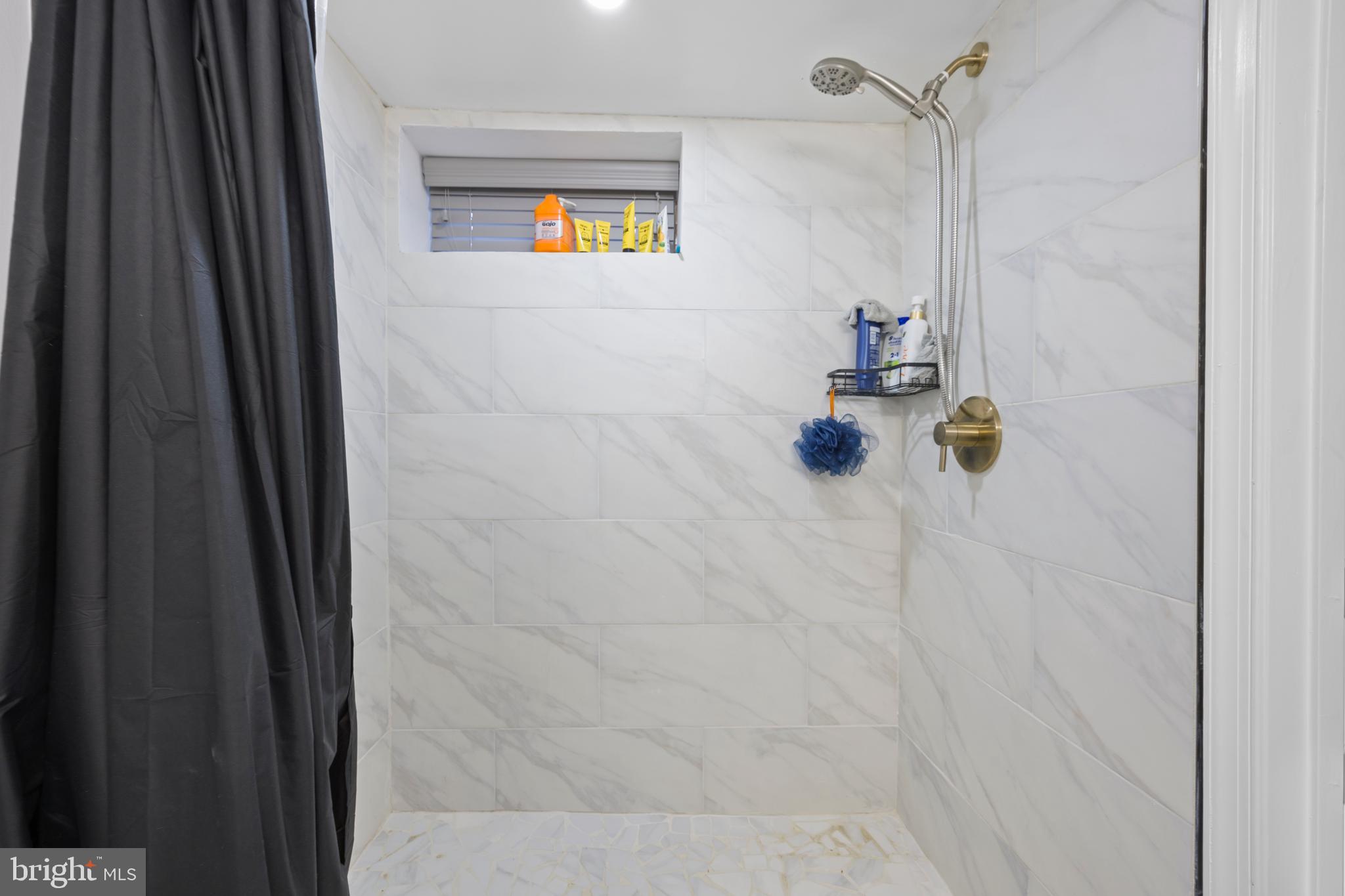 4511 Marble Hall Road Baltimore, MD 21239 - Photo 39 of 48 a bathroom with a shower