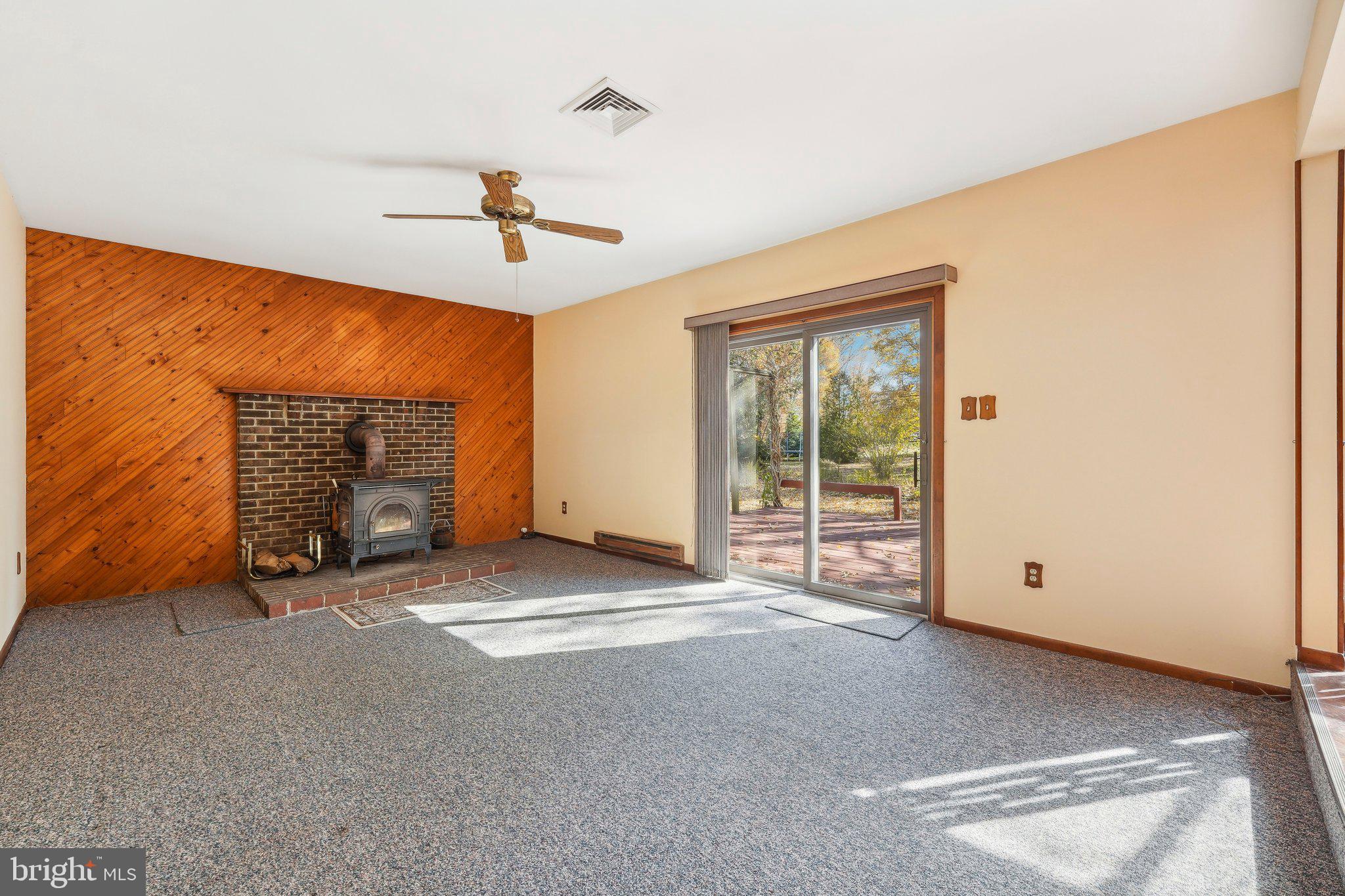 130 Forrest Road Telford, PA 18969 - Photo 4 of 42 Fireplace and sliding doors to deck
