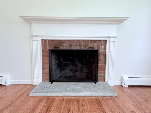 a living room with a fireplace