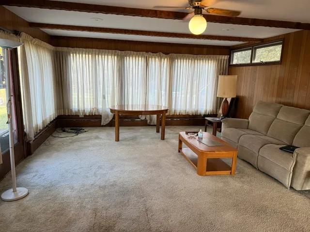 an outdoor living room with furniture and a window