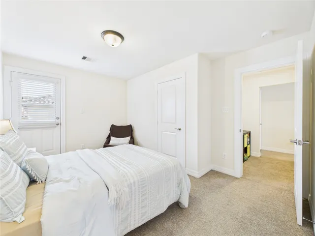 a bedroom with a bed and a walk in closet