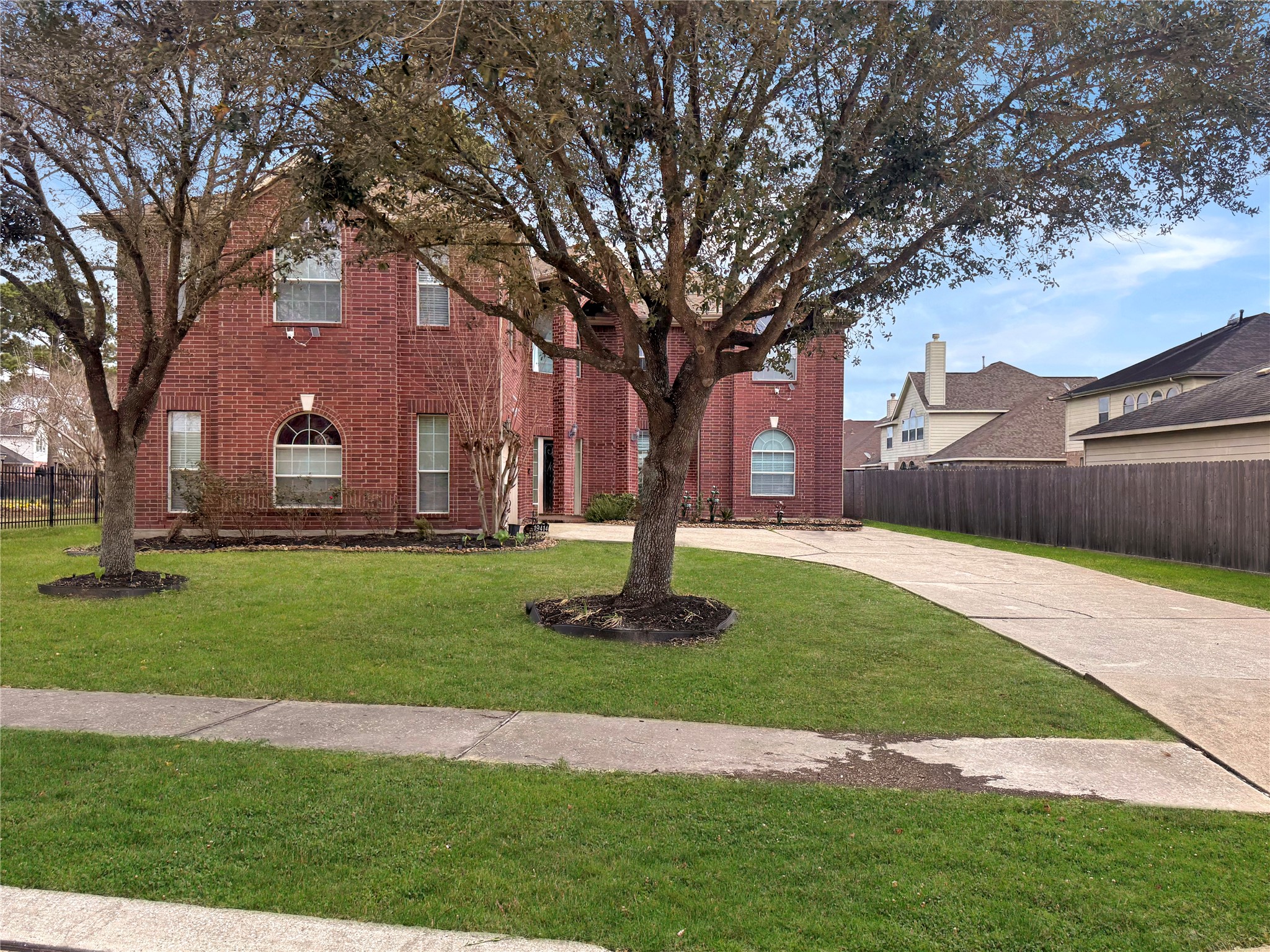 19414 Countryroad Dr Spring Spring, TX 77388 - Photo 3 of 8 a front view of a house with garden