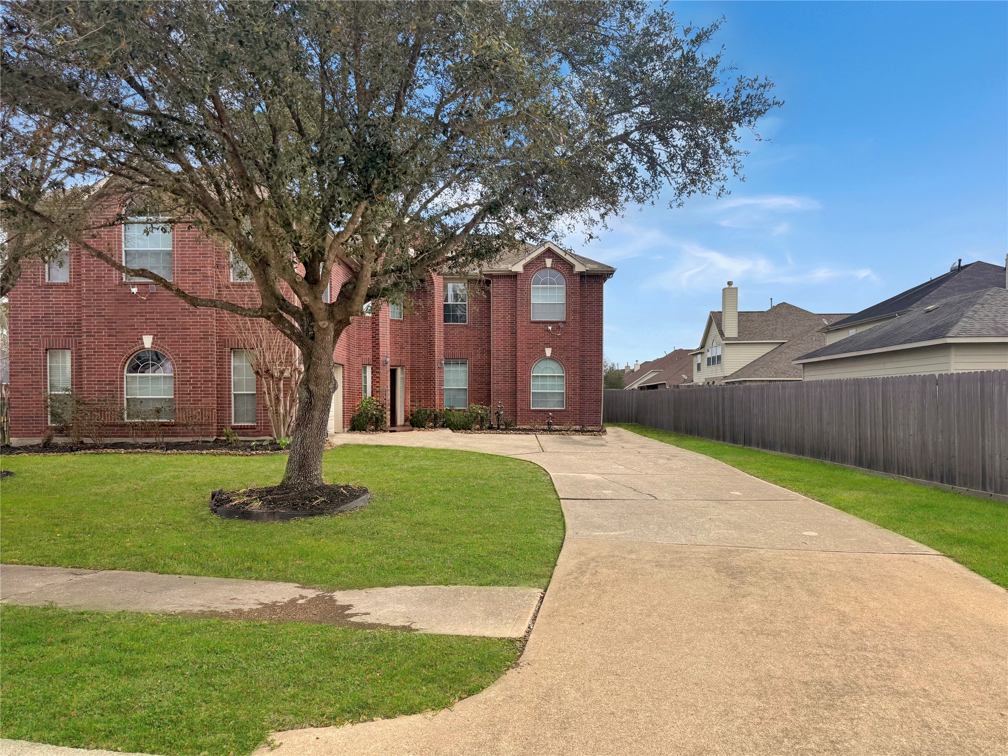 19414 Countryroad Dr Spring Spring, TX 77388 - Photo 4 of 8 a front view of a house with a yard