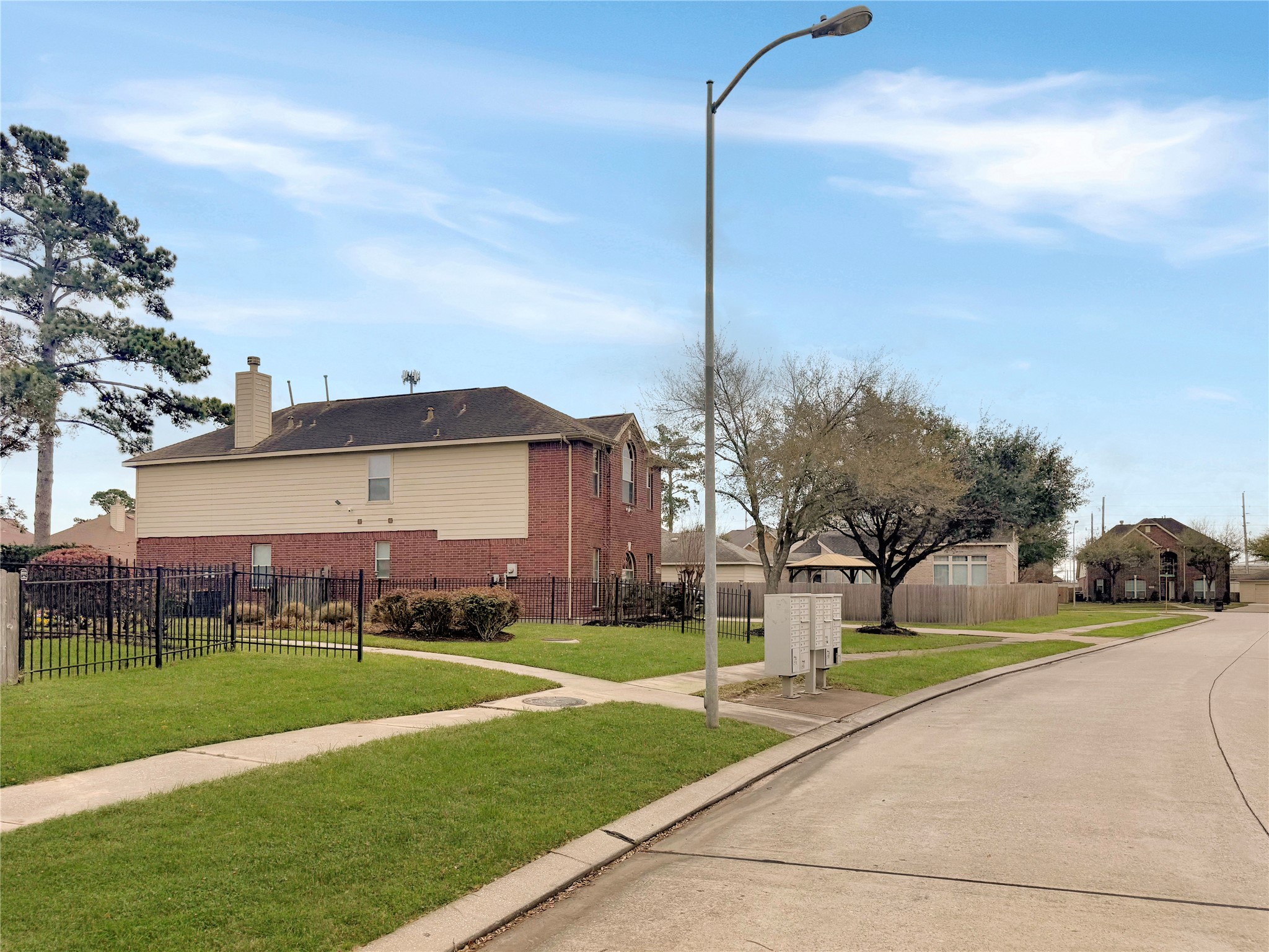 19414 Countryroad Dr Spring Spring, TX 77388 - Photo 7 of 8 a view of a big house with a big yard and palm trees