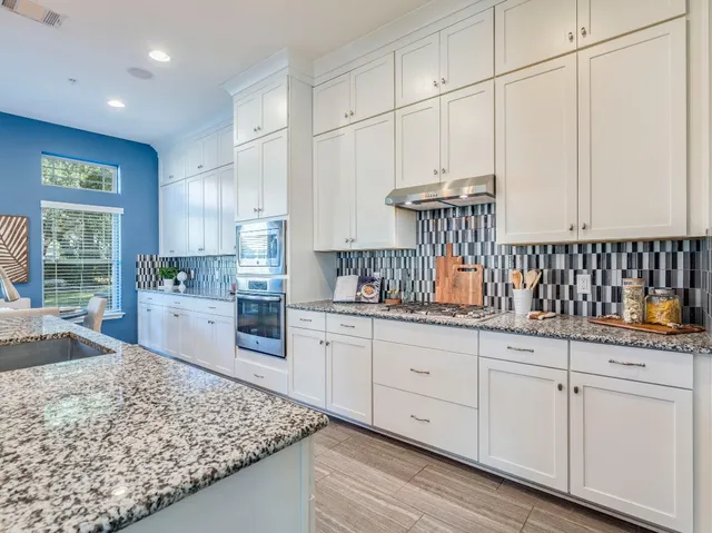 a very nice looking kitchen with a large window