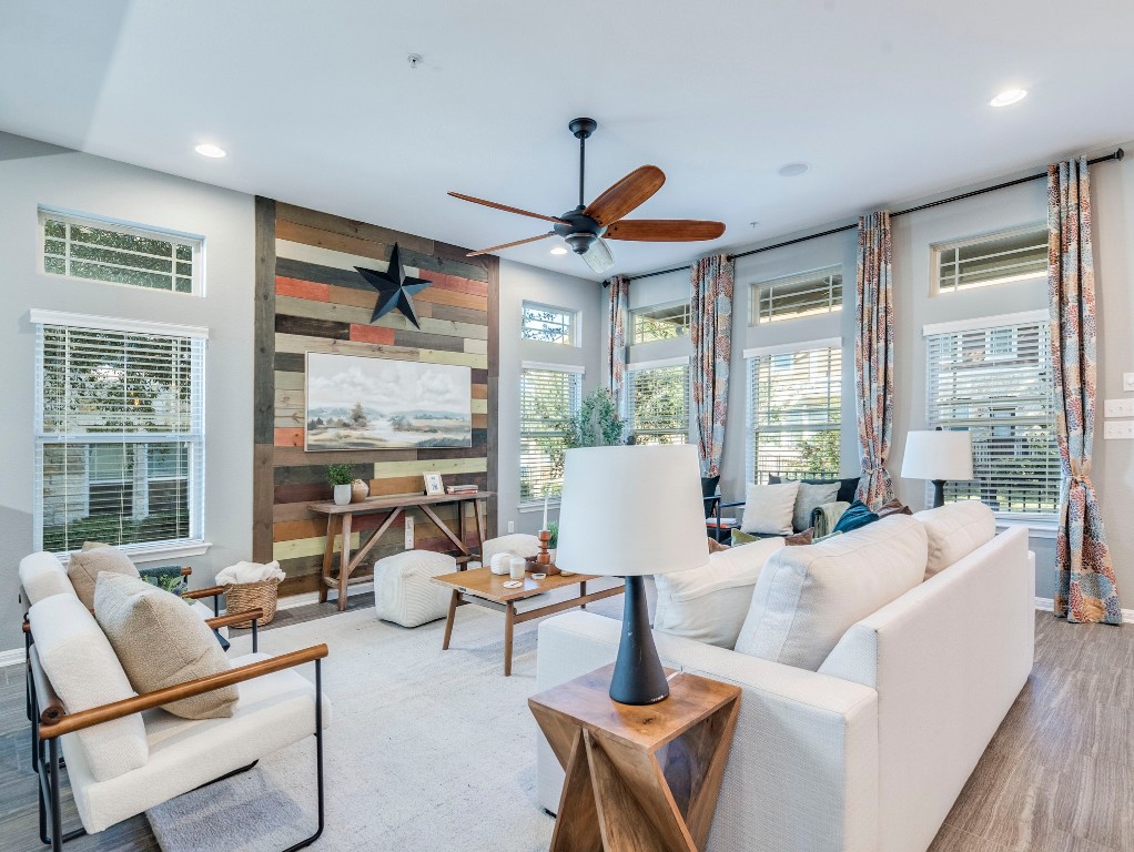 2930 Grand Oaks Loop, Unit 1903 Cedar Park, TX 78613 - Photo 13 of 36 a living room with furniture a large window and a chandelier