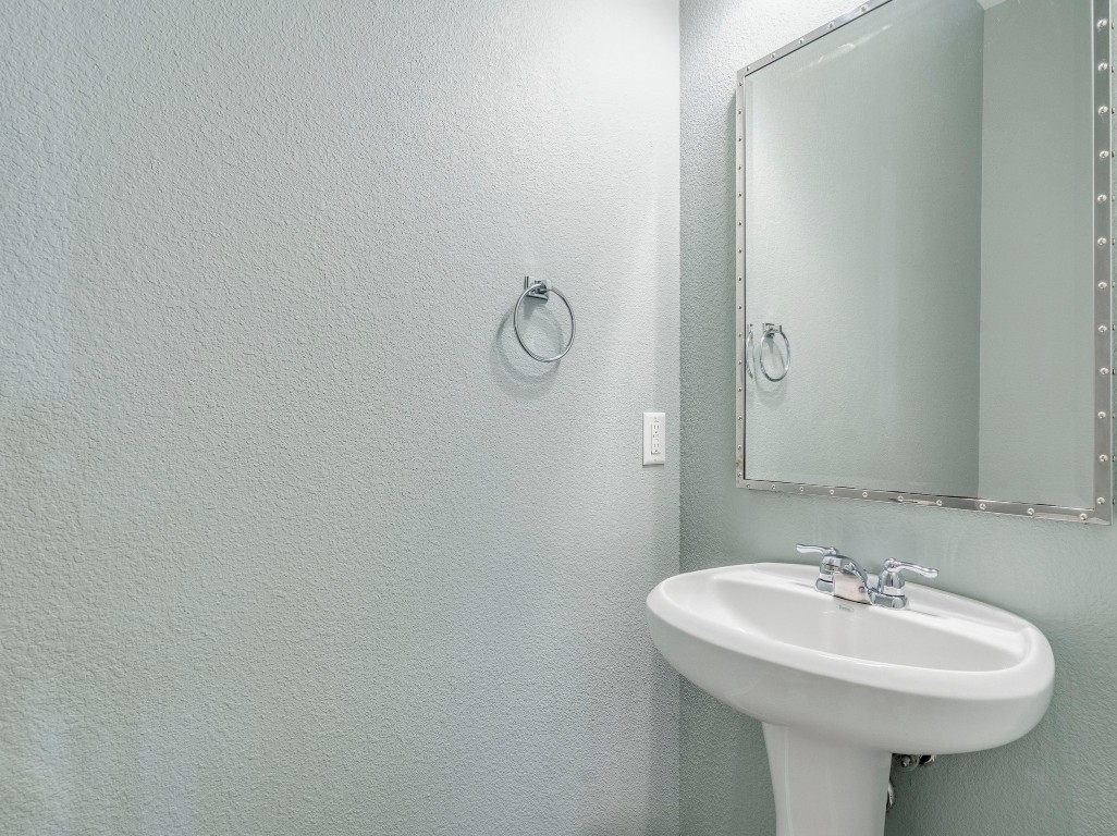 2930 Grand Oaks Loop, Unit 1903 Cedar Park, TX 78613 - Photo 17 of 36 a bathroom with a sink and mirror