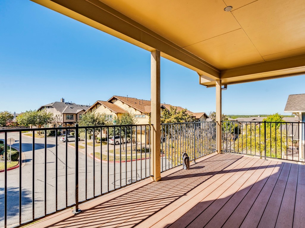 2930 Grand Oaks Loop, Unit 1903 Cedar Park, TX 78613 - Photo 20 of 36 a view of balcony with floor to ceiling window with wooden fence