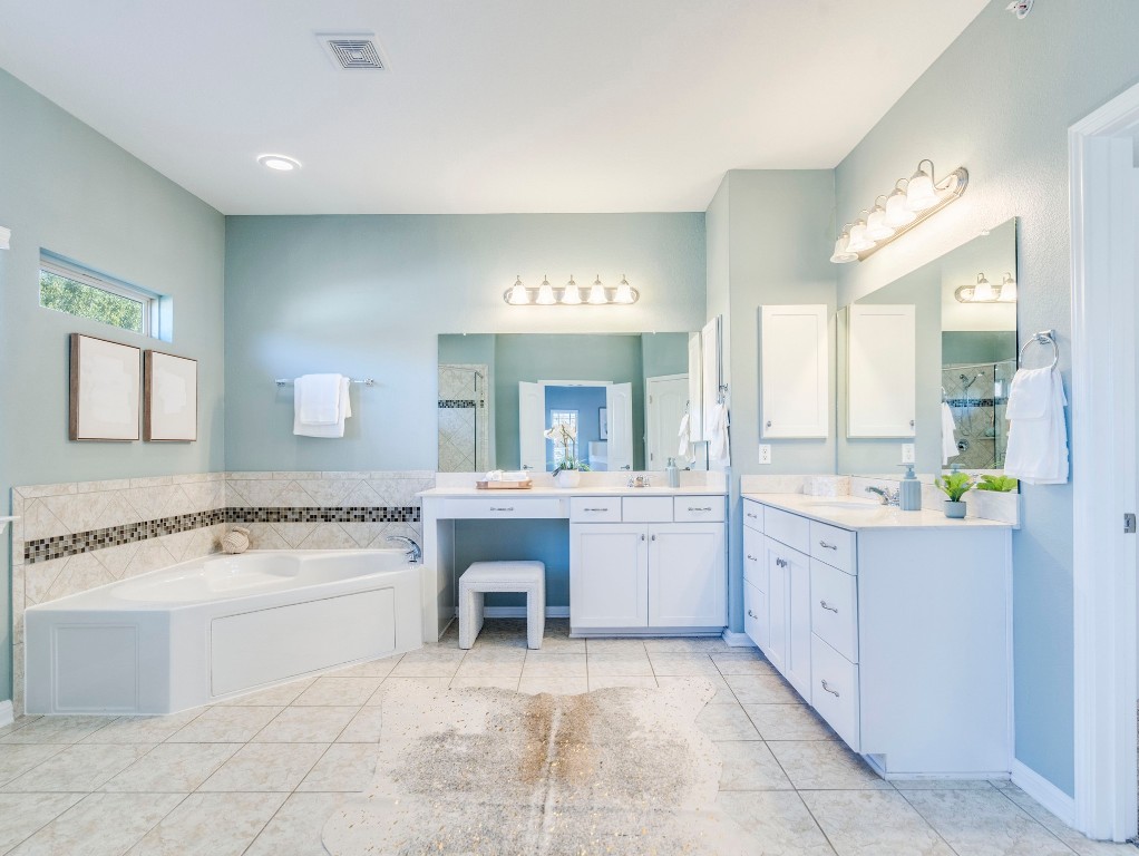 2930 Grand Oaks Loop, Unit 1903 Cedar Park, TX 78613 - Photo 23 of 36 a bathroom with a tub sink and mirror