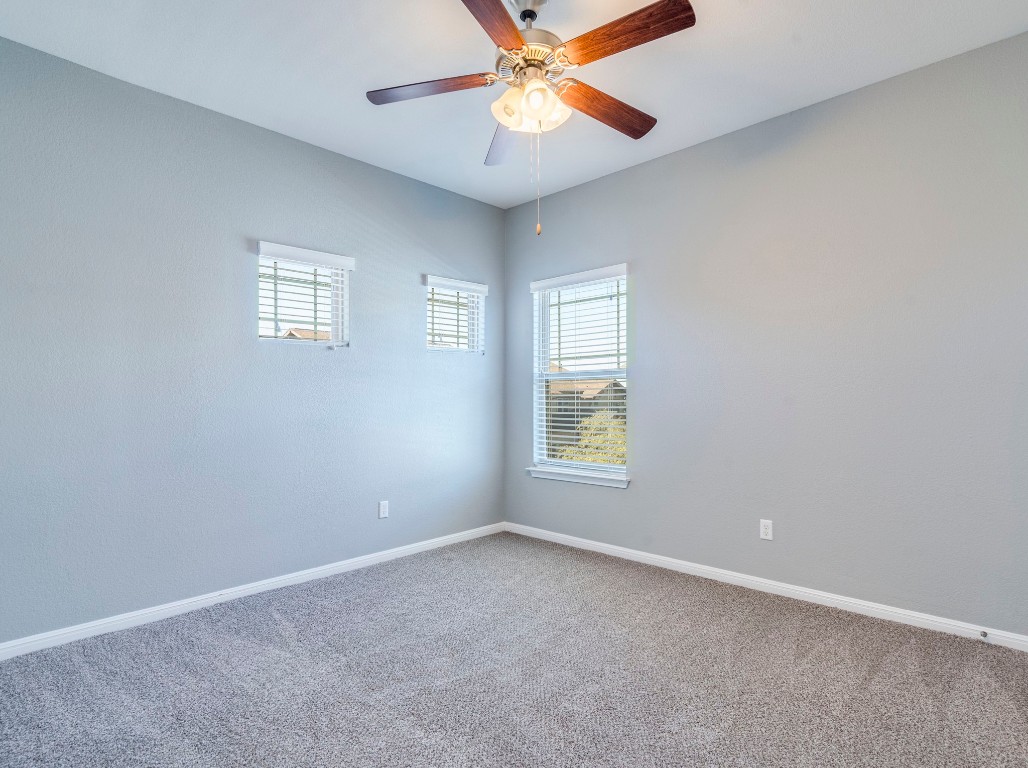 2930 Grand Oaks Loop, Unit 1903 Cedar Park, TX 78613 - Photo 27 of 36 an empty room with a window and a fan