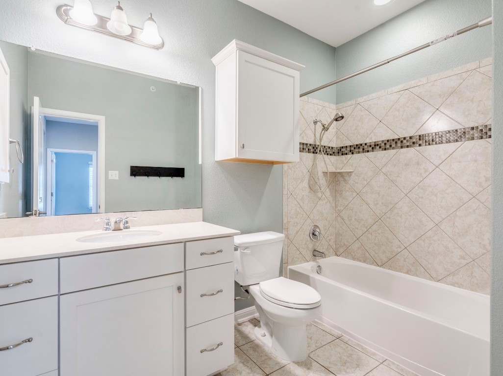 2930 Grand Oaks Loop, Unit 1903 Cedar Park, TX 78613 - Photo 31 of 36 a bathroom with a sink a toilet and bathtub