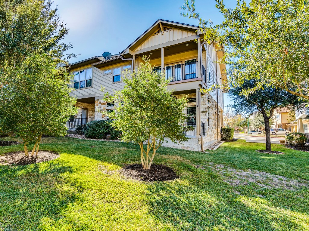 2930 Grand Oaks Loop, Unit 1903 Cedar Park, TX 78613 - Photo 35 of 36 a view of a house with backyard and trees