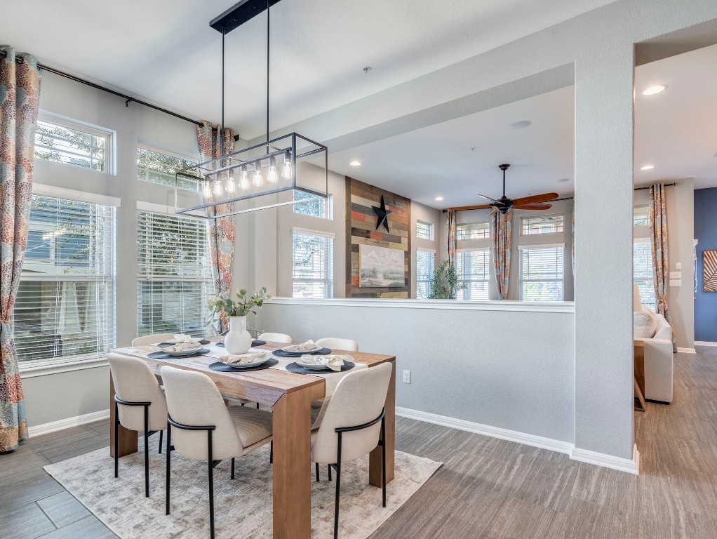 2930 Grand Oaks Loop, Unit 1903 Cedar Park, TX 78613 - Photo 5 of 36 a view of a dining room with furniture wooden floor and chandelier
