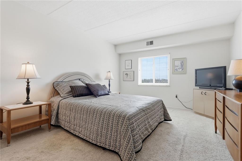 5600 Munhall Road, Unit 504 Pittsburgh, PA 15217 - Photo 27 of 41 Serene Primary suite with 2 walls of closets and an en-suite bath.