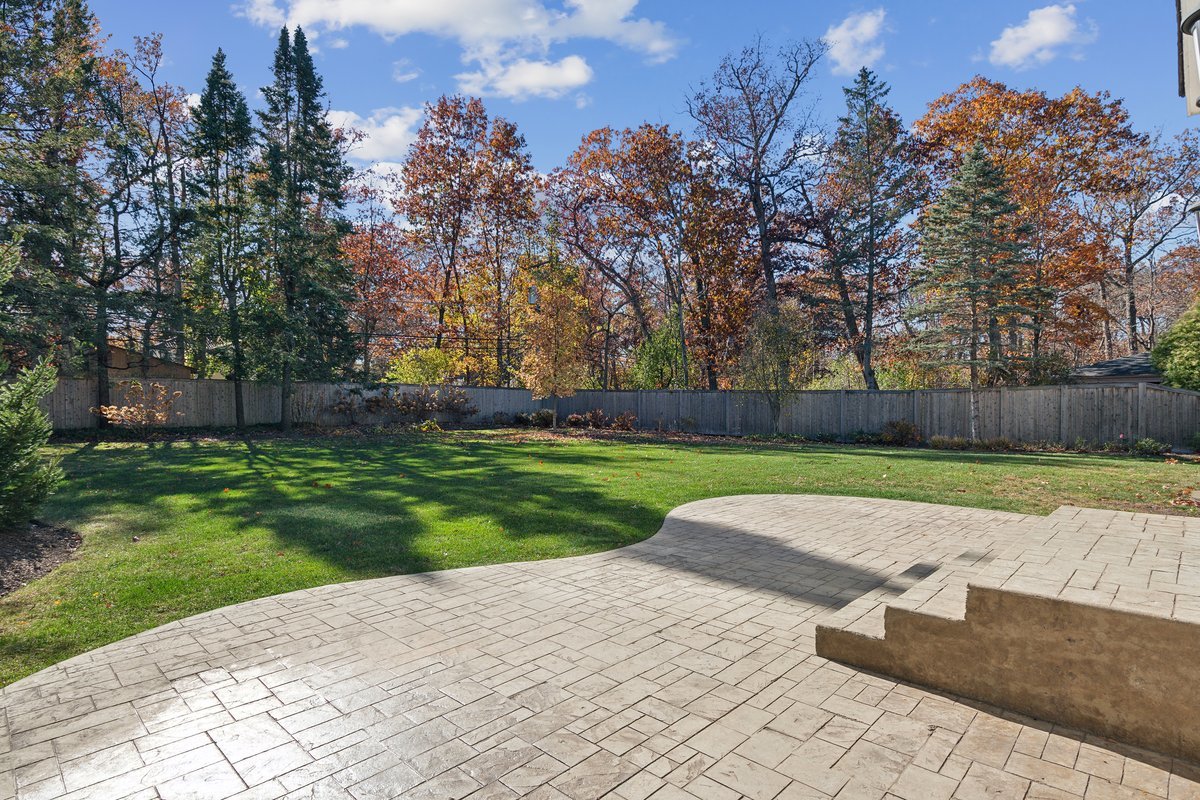 Undisclosed Address Lake Bluff, IL 60044 - Photo 4 of 5 a view of a yard with large tree and wooden fence