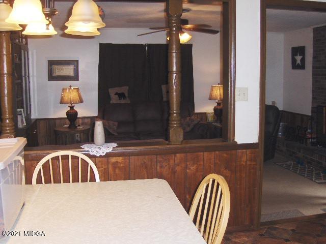7152 Goodall Mill Road Macon, GA 31216 - Photo 14 of 25 a kitchen with a table chairs and a wooden floor