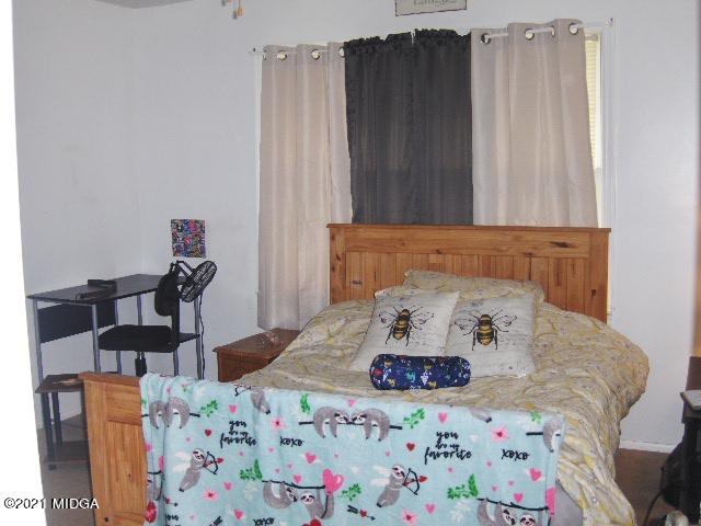 7152 Goodall Mill Road Macon, GA 31216 - Photo 20 of 25 a bedroom with a bed and a table in it