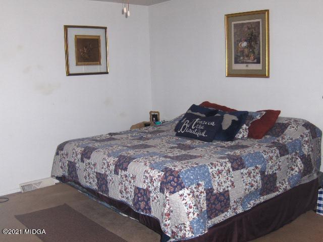 7152 Goodall Mill Road Macon, GA 31216 - Photo 21 of 25 a bedroom with a bed and painting on the wall