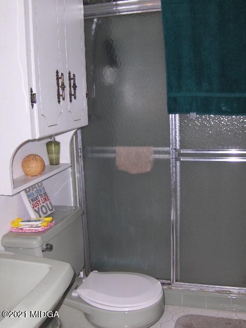7152 Goodall Mill Road Macon, GA 31216 - Photo 23 of 25 a bathroom with a toilet and a shower