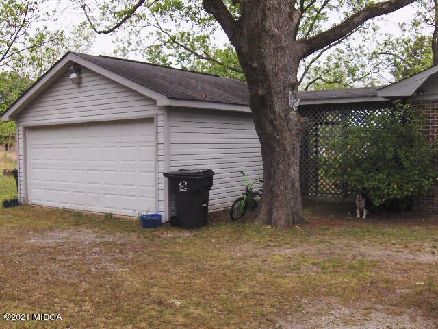 7152 Goodall Mill Road Macon, GA 31216 - Photo 4 of 25 a backyard of a house with lots of green space