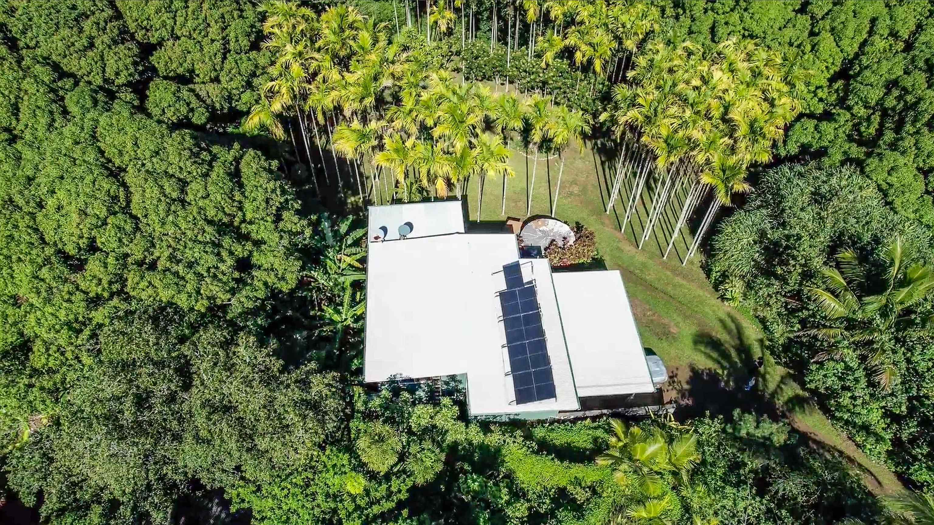 404 Puniawa Road Haiku, HI 96708 - Photo 36 of 36 an aerial view of a house with a yard
