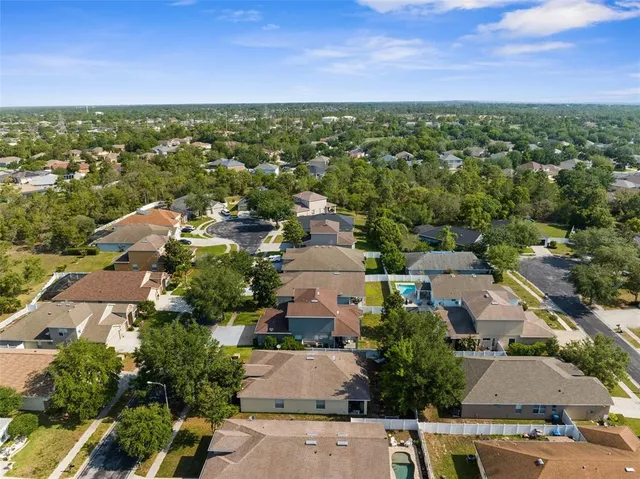 an aerial view of residential houses with outdoor space