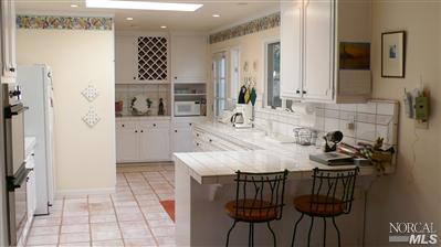 4190 Big Ranch Road Napa, CA 94558 - Photo 5 of 10 a bathroom with a sink a mirror and a shower