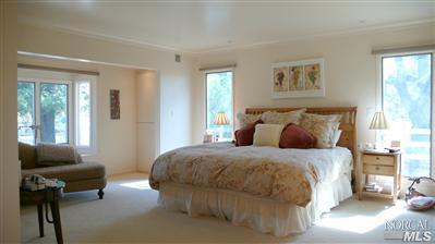 4190 Big Ranch Road Napa, CA 94558 - Photo 6 of 10 a bedroom with a bed and wooden floor