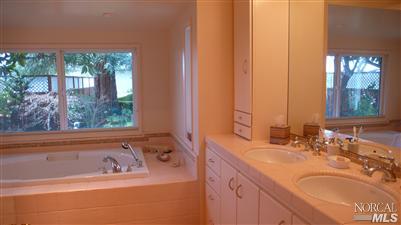 4190 Big Ranch Road Napa, CA 94558 - Photo 7 of 10 a bathroom with a sink and a bathtub