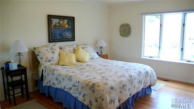 4190 Big Ranch Road Napa, CA 94558 - Photo 8 of 10 a bedroom with a bed and a window
