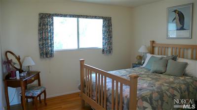 4190 Big Ranch Road Napa, CA 94558 - Photo 9 of 10 a bedroom with a bed and a window