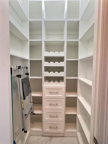 a kitchen with granite countertop kitchen island a sink and a wooden floor