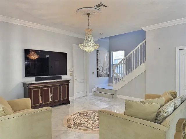 a view of a livingroom with furniture and window