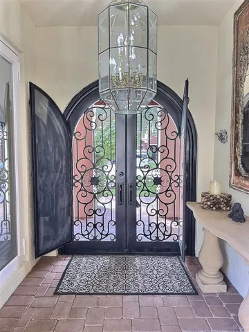 a view of a house with backyard porch and sitting area