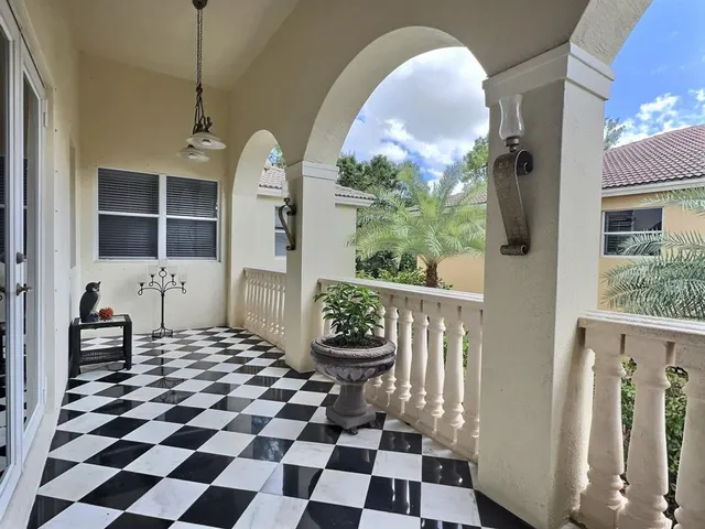 a spacious bathroom with a tub sink and glass door